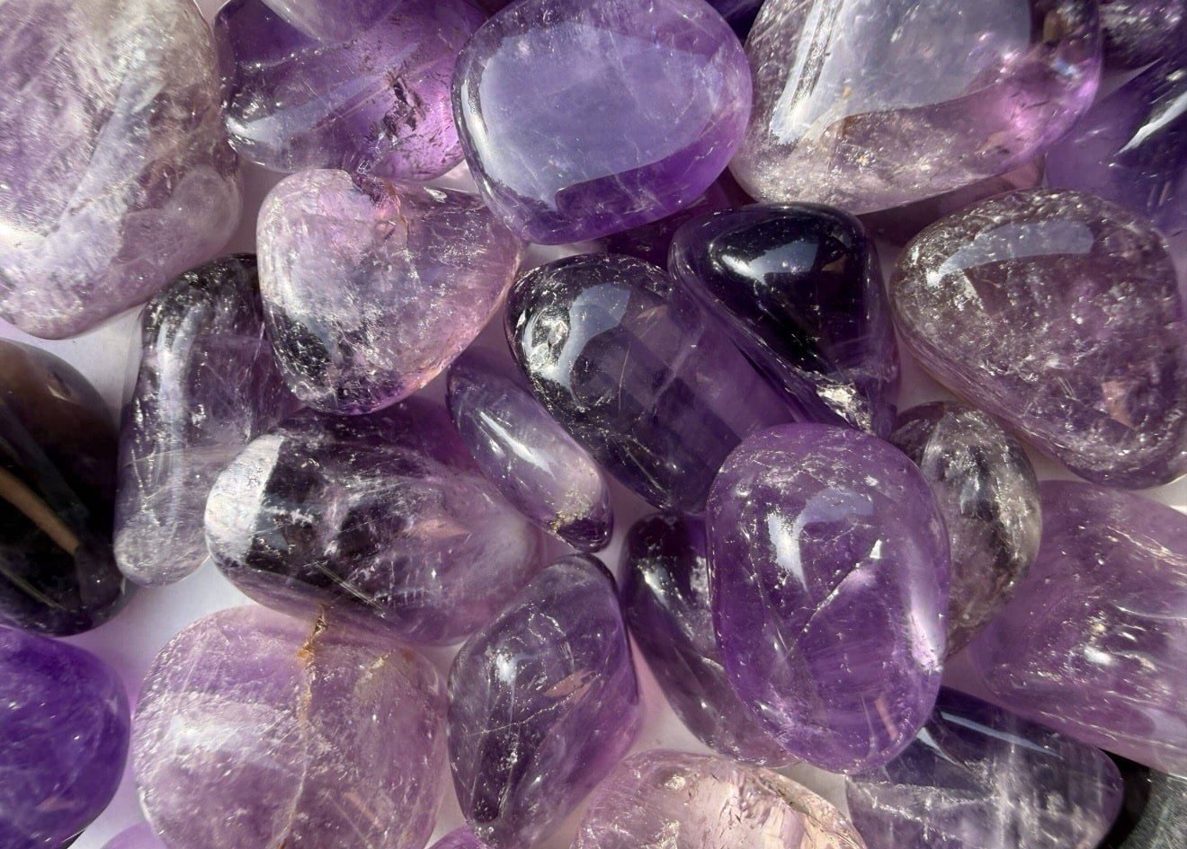 Amethyst Grade A Tumbled Stones with rich purple color and natural transparency
